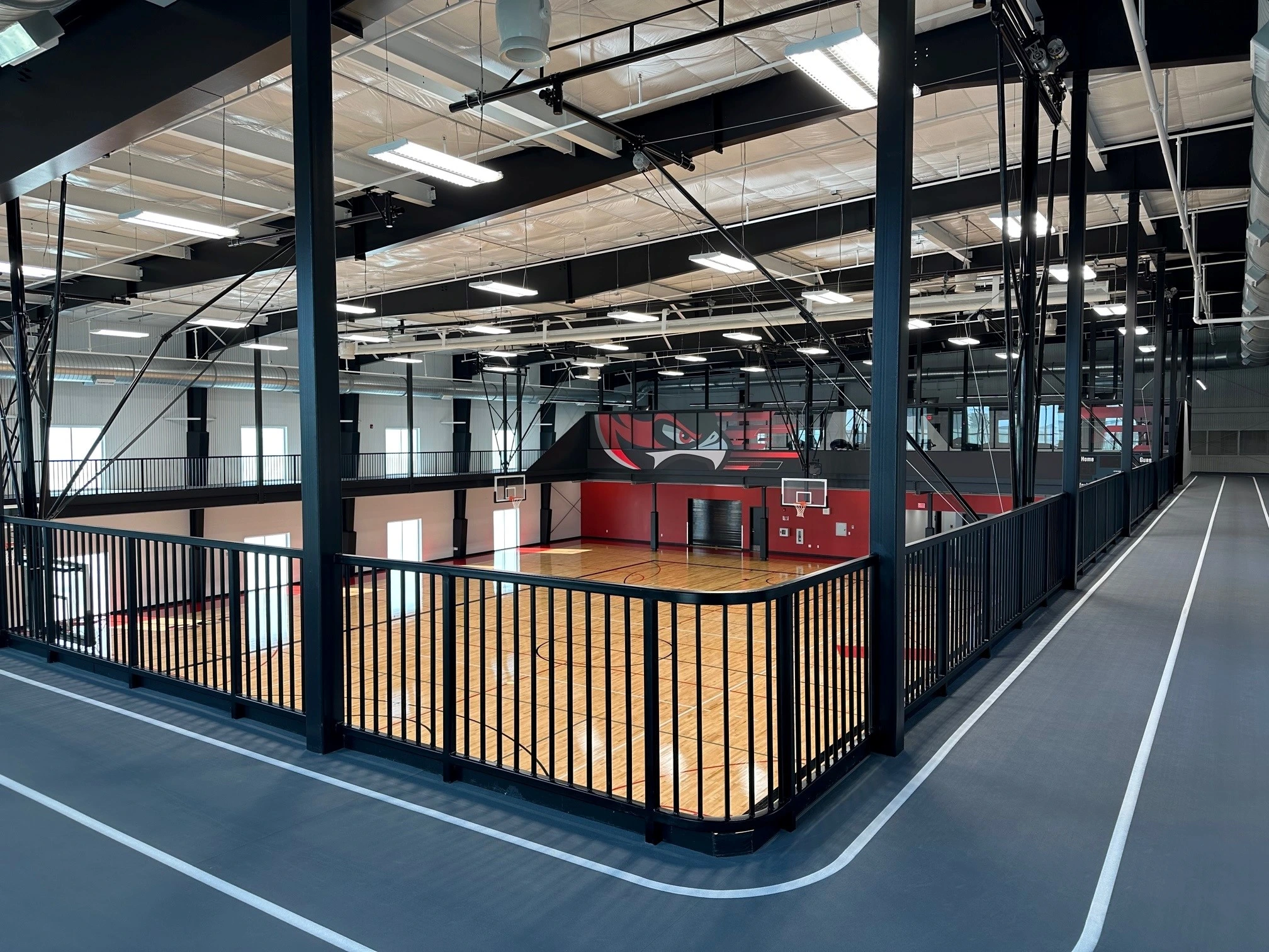 The Blackhawk Towers are seen from across the parking lot, where several cars are parked.